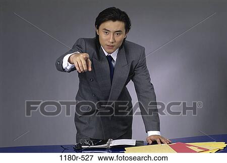 meeting, Asian, pointing, business, point, serious View Large Photo Image Stock Photo - meeting, Asian, pointing, business, point, serious. Fotosearch