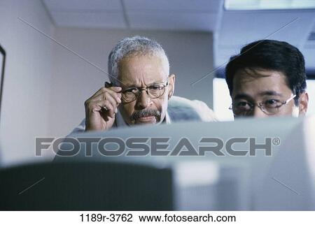 multiethnic, men, eyeglasses, computer, concentrating, business View Large Photo Image Stock Image - multiethnic, men, eyeglasses, computer, concentrating, business. Fotosearch