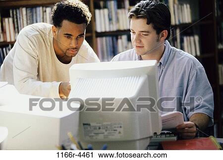 Stock Image - multiethnic, men, people, library, teamwork, computers, education. Fotosearch