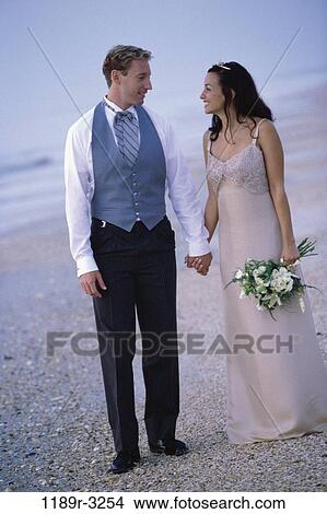 multiethnic, people, formal, walking, couple, beach, flowers View Large Photo Image Picture - multiethnic, people, formal, walking, couple, beach, flowers. Fotosearch