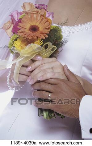 Stock Image - multiethnic, people, hands, pearls, wedding, bouquet. Fotosearch