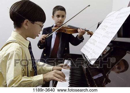 multiethnic, people, playing, piano, violin, children, play View Large Photo Image Stock Image - multiethnic, people, playing, piano, violin, children, play. Fotosearch