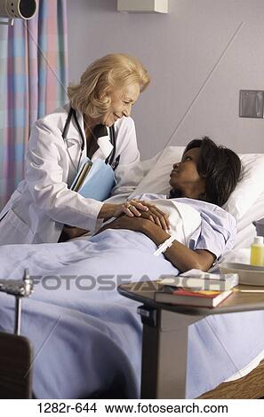 multiethnic, women, bed, patient, doctor, medicine, nurturing View Large Photo Image Picture - multiethnic, women, bed, patient, doctor, medicine, nurturing. Fotosearch