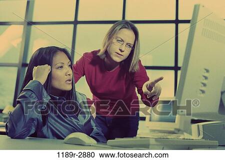 multiethnic, women, computer, concentrating, business, serious, using View Large Photo Image Stock Image - multiethnic, women, computer, concentrating, business, serious, using. Fotosearch