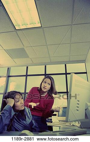 multiethnic, women, desk, computer, business, using, unsure View Large Photo Image Stock Image - multiethnic, women, desk, computer, business, using, unsure. Fotosearch