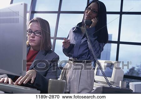 multiethnic, women, desk, telephone, talking, eyeglasses, phone View Large Photo Image Stock Image - multiethnic, women, desk, telephone, talking, eyeglasses, phone. Fotosearch