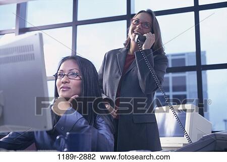 multiethnic, women, desk, telephone, talking, eyeglasses, phone View Large Photo Image Stock Image - multiethnic, women, desk, telephone, talking, eyeglasses, phone. Fotosearch