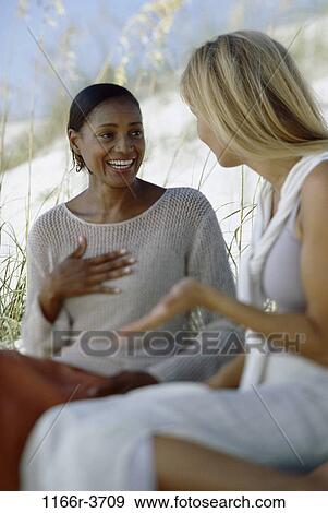 Stock Photo - multiethnic, women, people, beach, friends, pair, young adult. Fotosearch