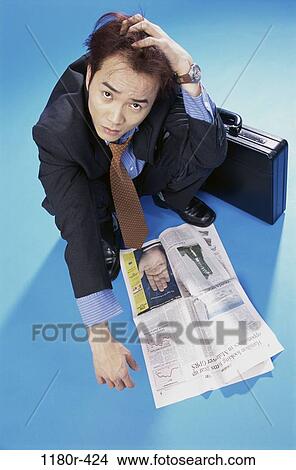 newspaper, briefcase, Asian, stress, business, Middle-aged View Large Photo Image Picture - newspaper, briefcase, Asian, stress, business, Middle-aged. Fotosearch