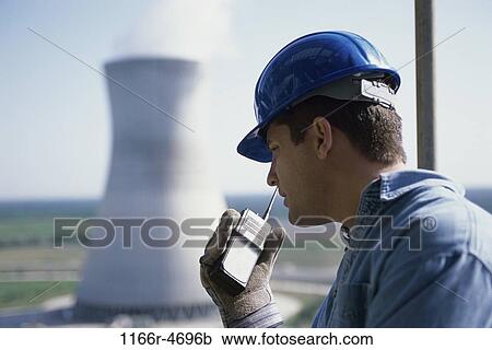 Stock Image - occupations, outdoors, Middle-aged, trades, energy, hardhat. Fotosearch