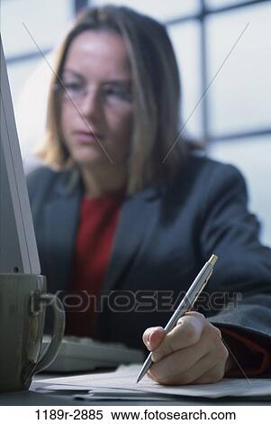 pen, desk, woman, computer, business, writing, using View Large Photo Image Stock Photography - pen, desk, woman, computer, business, writing, using. Fotosearch