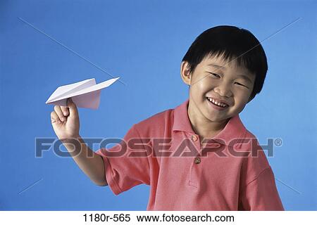 people, airplane, paper, Asian, holding, boy, child View Large Photo Image Stock Photography - people, airplane, paper, Asian, holding, boy, child. Fotosearch