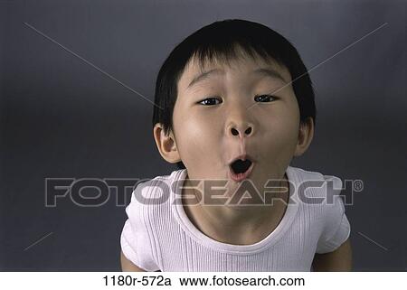 Stock Image - people, Asian, boy, child, funny, humor, indoors. Fotosearch