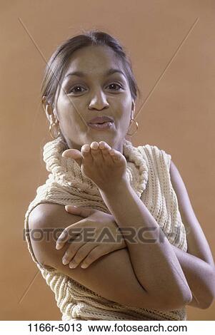 people, Asian, Indian, blowing, turtleneck View Large Photo Image Stock Image - people, Asian, Indian, blowing, turtleneck. Fotosearch