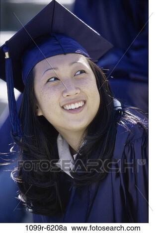 Stock Image - people, Asian, outdoors, achievement, cap, education, student. Fotosearch