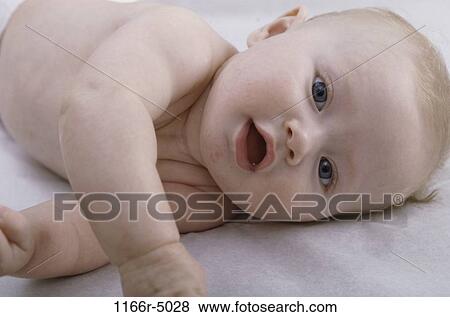 people, baby, laying, indoors, Caucasian, lay View Large Photo Image Stock Photo - people, baby, laying, indoors, Caucasian, lay. Fotosearch