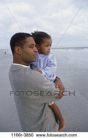 Stock Image - people, beach, holding, looking, family, father, daughter. Fotosearch