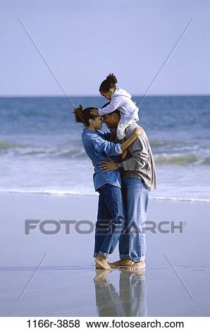 people, beach, hugging, carrying, unity, family, affection View Large Photo Image Stock Photo - people, beach, hugging, carrying, unity, family, affection. Fotosearch