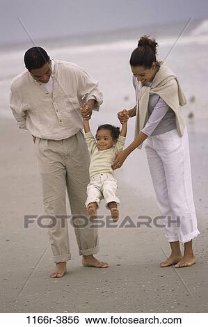 people, beach, swinging, swing, lifting, family, daughter View Large Photo Image Stock Photograph - people, beach, swinging, swing, lifting, family, daughter. Fotosearch
