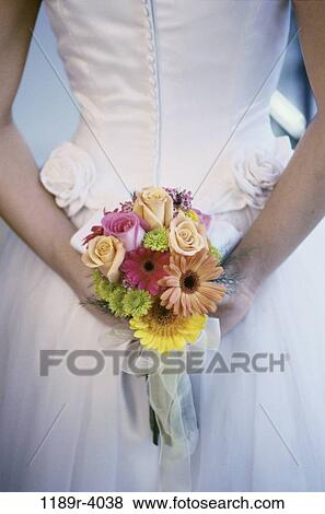 Stock Photo - people, behind, wedding, bouquet, buttons, bride. Fotosearch
