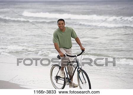 people, bicycle, beach, riding, waves, ride View Large Photo Image Stock Image - people, bicycle, beach, riding, waves, ride. Fotosearch