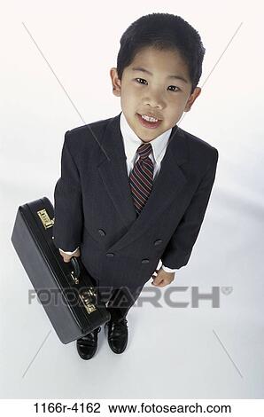 Stock Image - people, briefcase, suit, Asian, boy, costume, business. Fotosearch