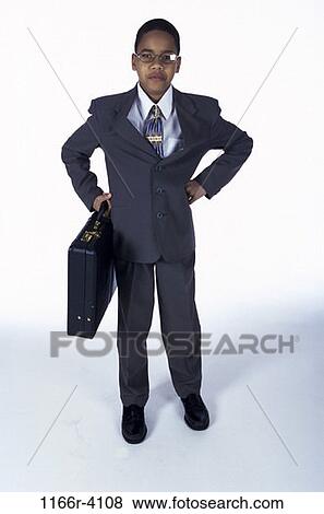 Stock Photo - people, briefcase, suit, boy, costume, business, serious. Fotosearch