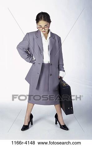 Stock Photo - people, briefcase, suit, eyeglasses, Hispanic, girl, business. Fotosearch