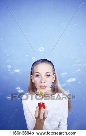 people, bubbles, blowing, blond, indoors, teenager View Large Photo Image Stock Image - people, bubbles, blowing, blond, indoors, teenager. Fotosearch