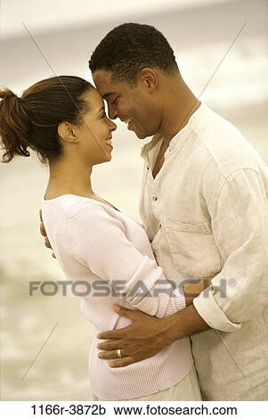 people, couple, beach, embracing, embrace, clothed, African-American View Large Photo Image Stock Image - people, couple, beach, embracing, embrace, clothed, African-American. Fotosearch