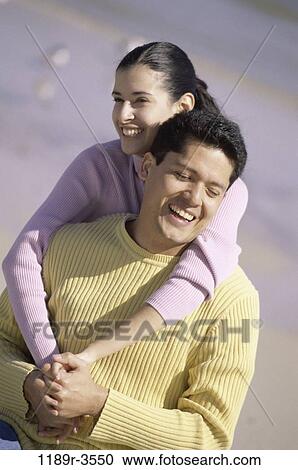 people, couple, beach, embracing, embrace, clothed, sweaters View Large Photo Image Stock Image - people, couple, beach, embracing, embrace, clothed, sweaters. Fotosearch