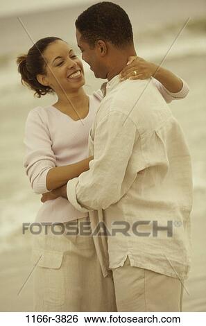 people, couple, beach, embracing, embrace, clothed, African-American View Large Photo Image Stock Photograph - people, couple, beach, embracing, embrace, clothed, African-American. Fotosearch