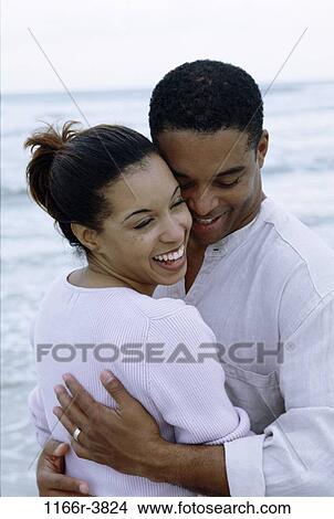 people, couple, beach, hugging, embracing, embrace, hug View Large Photo Image Picture - people, couple, beach, hugging, embracing, embrace, hug. Fotosearch