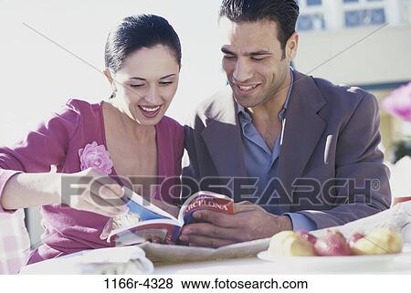 people, couple, Hispanic, reading, book, vacations, planning View Large Photo Image Stock Photo - people, couple, Hispanic, reading, book, vacations, planning. Fotosearch