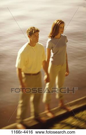 Stock Photograph - people, couple, lake, outdoors, Caucasian, young adult, Young couples outdoors. Fotosearch