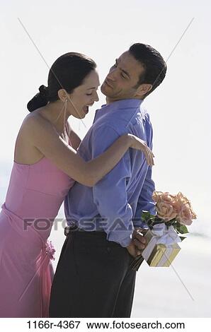 people, couple, outdoors, romantic, surprise, gift, romance View Large Photo Image Stock Photo - people, couple, outdoors, romantic, surprise, gift, romance. Fotosearch