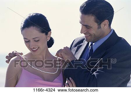 people, couple, pearls, outdoors, romantic, necklace, gift View Large Photo Image Picture - people, couple, pearls, outdoors, romantic, necklace, gift. Fotosearch
