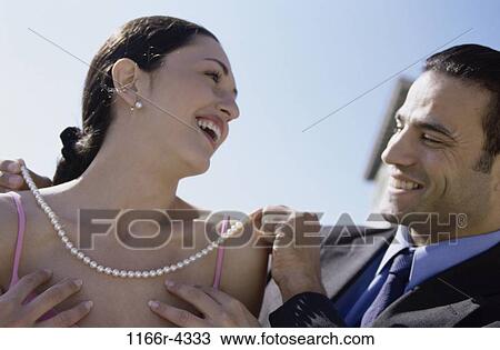 people, couple, pearls, outdoors, romantic, necklace, gift View Large Photo Image Stock Image - people, couple, pearls, outdoors, romantic, necklace, gift. Fotosearch