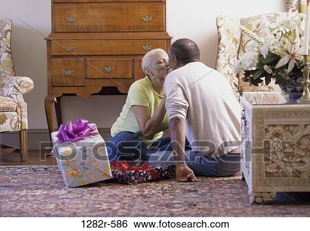 Stock Photograph - people, couple, senior, birthday, gifts, presents, anniversary. Fotosearch
