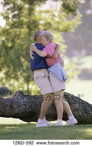 Stock Image - people, couple, senior, outdoors, romantic, hugging, romance. Fotosearch
