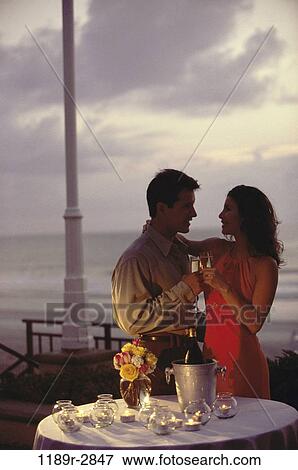 people, couple, toasting, drinking, beach, romantic, romance View Large Photo Image Stock Photo - people, couple, toasting, drinking, beach, romantic, romance. Fotosearch