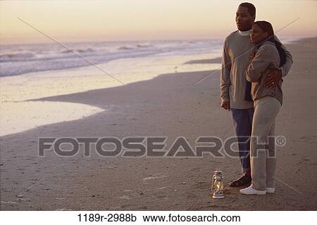 people, couple, watch, sunset, beach, sweater, watching View Large Photo Image Stock Image - people, couple, watch, sunset, beach, sweater, watching. Fotosearch