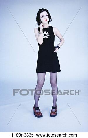 people, dress, standing, stand, indoors, teenager View Large Photo Image Stock Photography - people, dress, standing, stand, indoors, teenager. Fotosearch