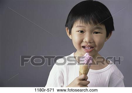 Stock Image - people, eating, Asian, ice cream, boy, child, dairy. Fotosearch