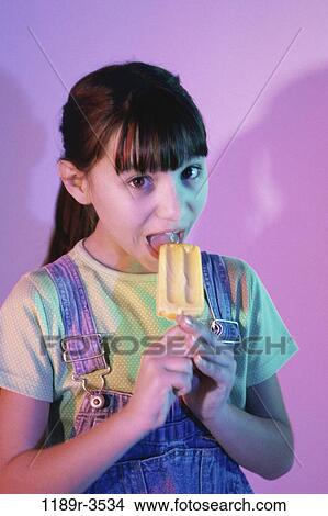 people, eating, girl, child, snack, brunette, indoors View Large Photo Image Picture - people, eating, girl, child, snack, brunette, indoors. Fotosearch