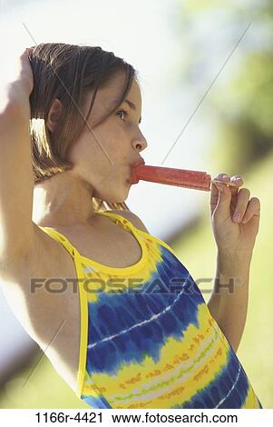 people, eating, girl, outdoors, child, brunette, dessert View Large Photo Image Stock Image - people, eating, girl, outdoors, child, brunette, dessert. Fotosearch