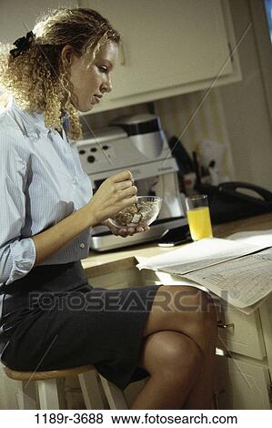 people, eating, home, woman, morning, table, newspaper View Large Photo Image Stock Photo - people, eating, home, woman, morning, table, newspaper. Fotosearch