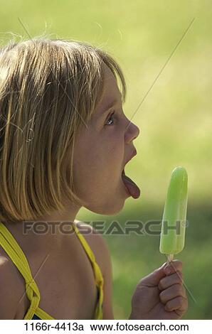Stock Image - people, eating, licking, girl, outdoors, child, blond. Fotosearch