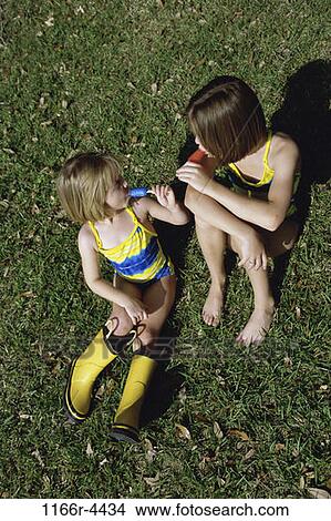 people, eating, outdoors, children, girls, Popsicles, Caucasian View Large Photo Image Picture - people, eating, outdoors, children, girls, Popsicles, Caucasian. Fotosearch
