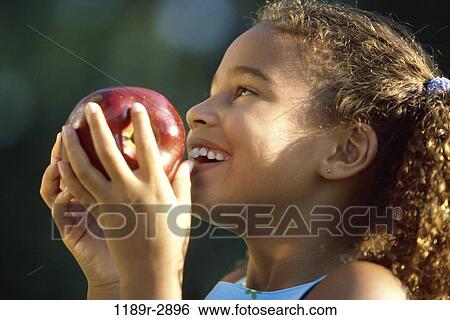 people, eating, profile, apple, fruit, girl, outdoors View Large Photo Image Stock Photograph - people, eating, profile, apple, fruit, girl, outdoors. Fotosearch
